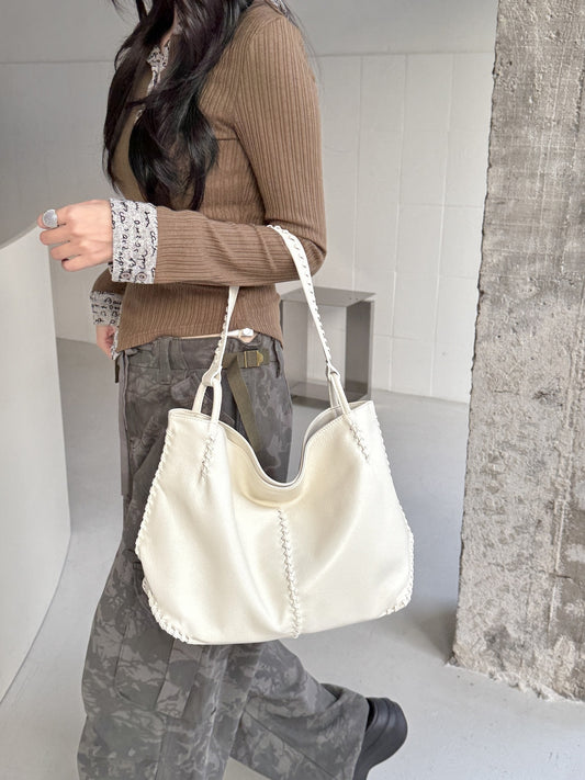 Women's Top Layer Cowhide Large Capacity Commuter Simple Woven Stitching Underarm Bag