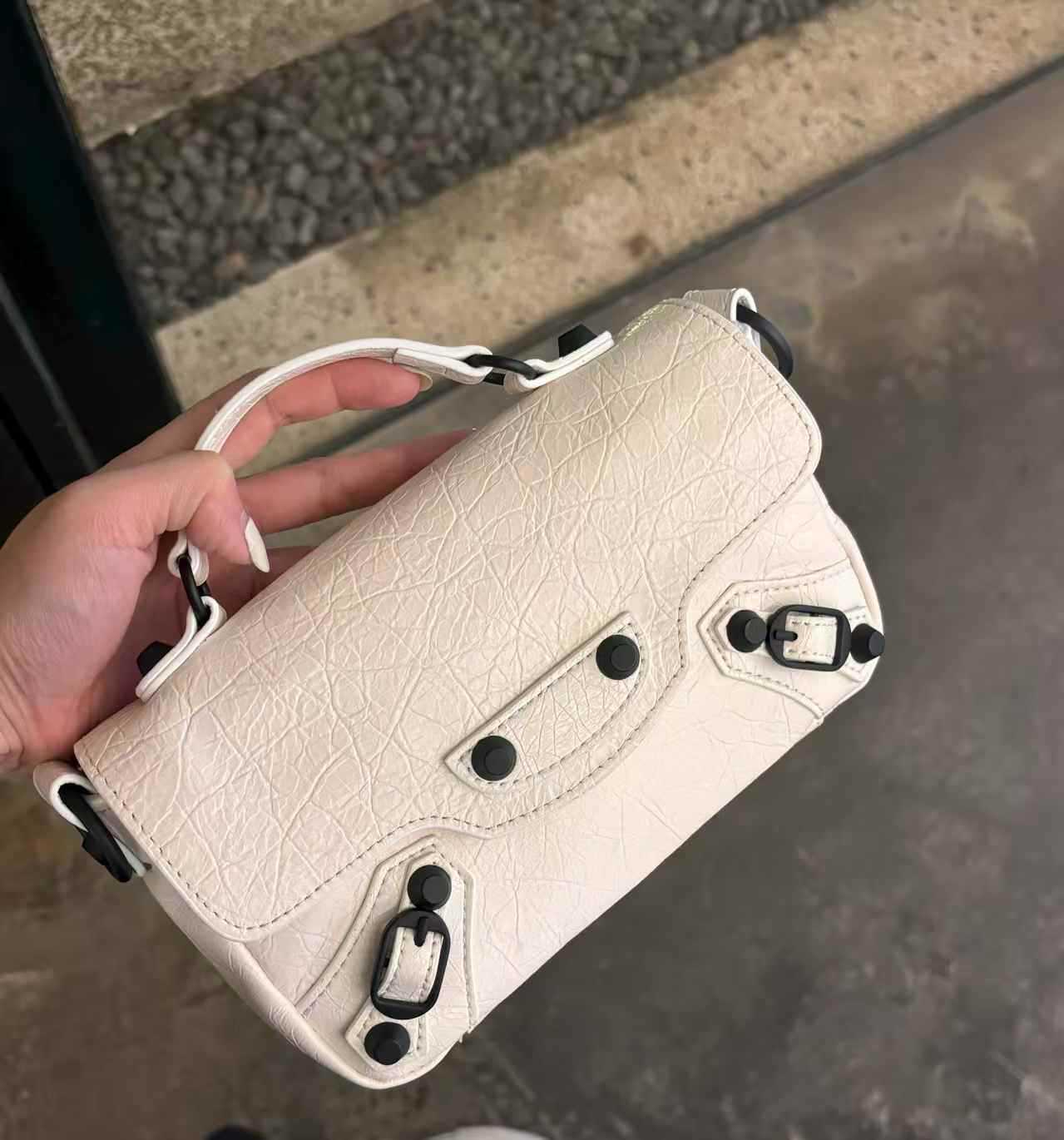 Women's First Layer Oil Wax Cowhide Studded Pouch Women's Messenger Bag