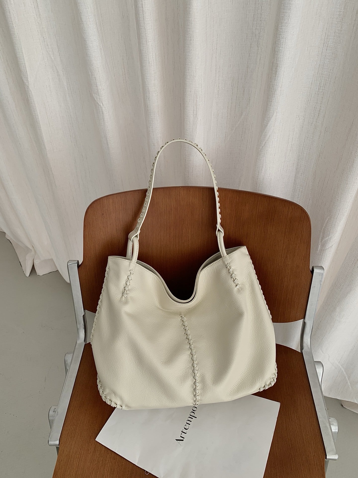 Women's Top Layer Cowhide Large Capacity Commuter Simple Woven Stitching Underarm Bag